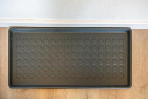 a close up of a metal grate on a wall at Komfortable Wohnung mit Terrasse für 5 Personen! in Baesweiler