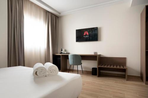 Ένα ή περισσότερα κρεβάτια σε δωμάτιο στο Alora Hotel Mérida