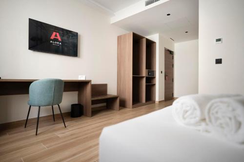 Ένα ή περισσότερα κρεβάτια σε δωμάτιο στο Alora Hotel Mérida