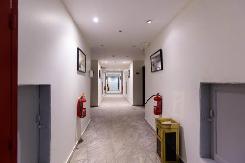 a hallway with two fire hydrants on the walls at فندق السليمانيه والرمال الزرقاء in Riyadh