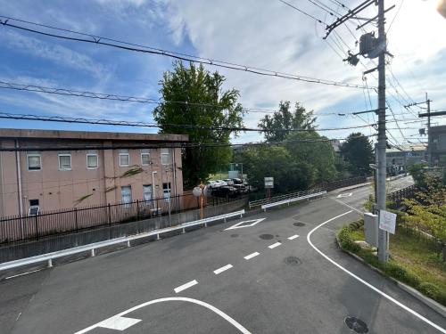 an empty street with a building on the side at 大和の宿 Kitabukuro201 in Nara