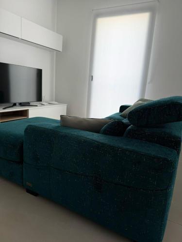 Una televisión o centro de entretenimiento en Gc Luxury Apartments e Spa