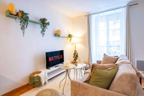 TV a/nebo společenská místnost v ubytování 4 Guests Flat - Place Monge