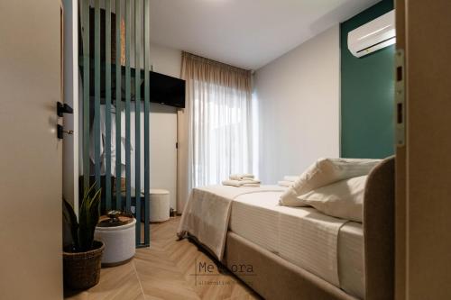 Ένα ή περισσότερα κρεβάτια σε δωμάτιο στο Meliora