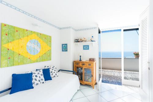 a bedroom with a bed and a view of the ocean at Casa William in Positano
