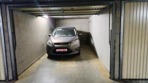 a small car parked in a parking garage at Huis Hersinde in Blankenberge