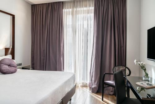Letto o letti in una camera di Vincci Palace