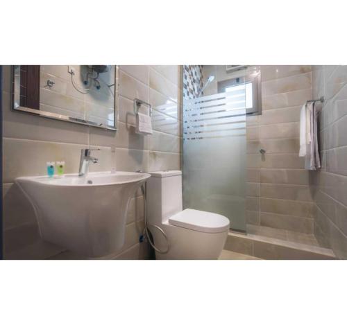 Ένα μπάνιο στο Palette Al Louloah Al Baraqah Aparthotel