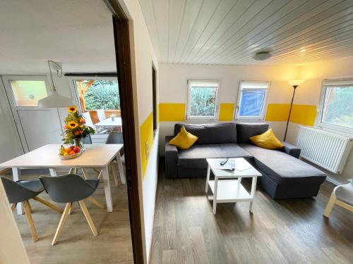 a living room with a couch and a table at Ferienhaus Renate in Sassenberg