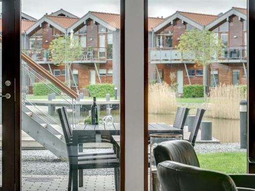 a view of a table and chairs from a window at Apartment Allyson - 450m from the sea by Interhome in Bogense