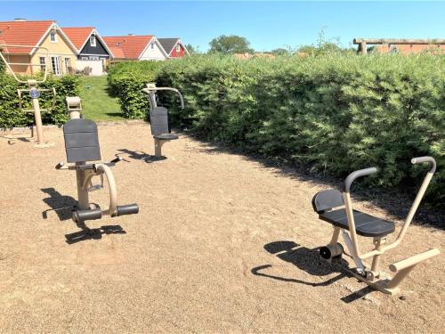 a group of three exercise chairs sitting on the ground at Holiday Home Daniela - 300m from the sea by Interhome in Bro
