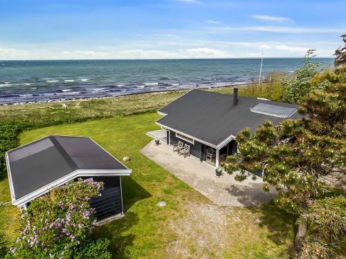 an aerial view of a house next to the ocean at Holiday Home Stacie - 10m from the sea by Interhome in Gedser