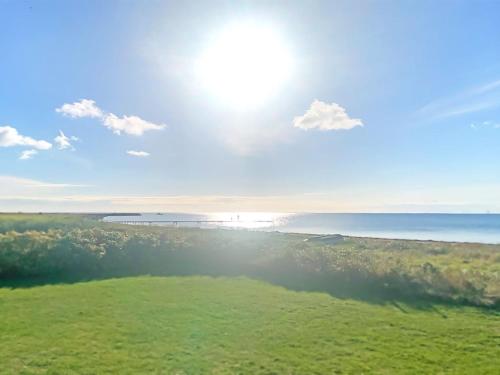 an image of the sun shining over the ocean at Holiday Home Stacie - 10m from the sea by Interhome in Gedser