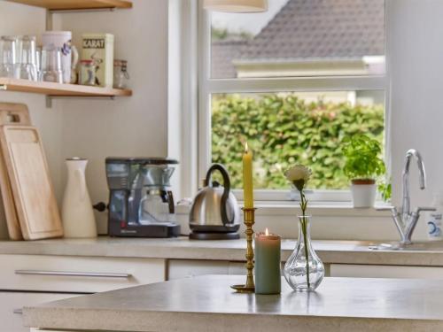 a kitchen counter with a sink and a window at Holiday Home Bjerund - 250m from the sea by Interhome in Haderslev