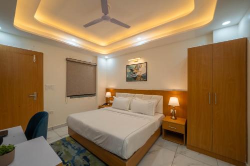 Ένα ή περισσότερα κρεβάτια σε δωμάτιο στο Perfectstayz Premium Krishna Abode