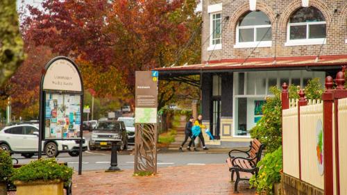 a street with people walking down the street at Cooinda Mountain Retreat in Blackheath