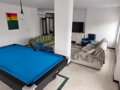 a living room with a pool table and a couch at Casa Alameda in Alameda