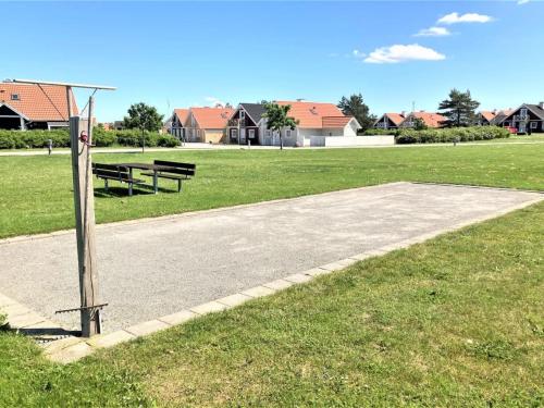 a park with a picnic table in a field at Holiday Home Askan - 200m from the sea by Interhome in Bro