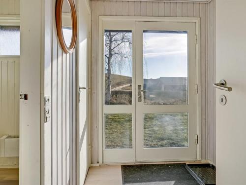 a door in a room with a window at Holiday Home Kalle - 400m from the sea by Interhome in Hårby