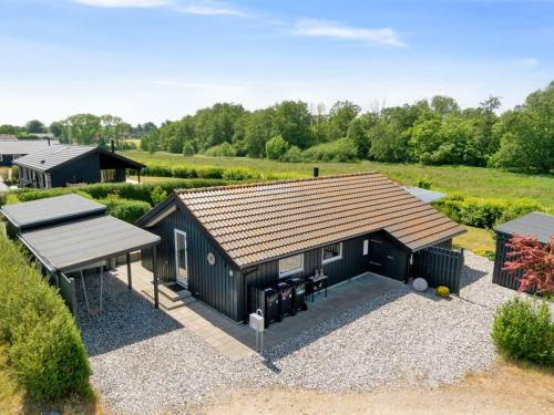 an overhead view of a black shed with a pitched roof at Holiday Home Kulben - 450m from the sea by Interhome in Frørup