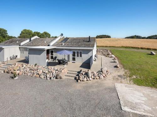 a house with a lot of sheep in front of it at Apartment Henne - 2-5km from the sea by Interhome in Humble