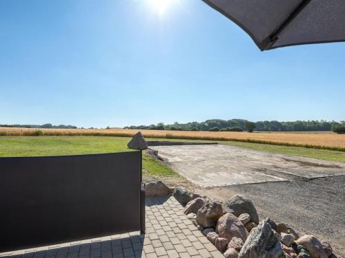 a view of a field from the side of a building at Apartment Henne - 2-5km from the sea by Interhome in Humble