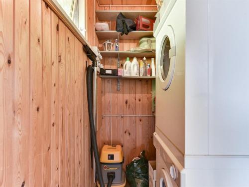 a utility room with a washer and dryer at Holiday Home Miriam - 300m from the sea by Interhome in Ebberup