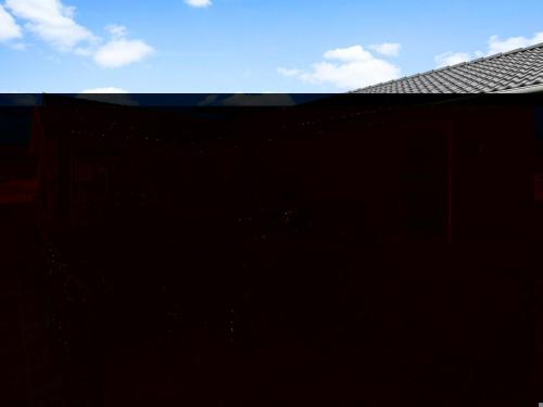 a black building with a blue sky in the background at Holiday Home Yakari - 300m from the sea by Interhome in Haderslev