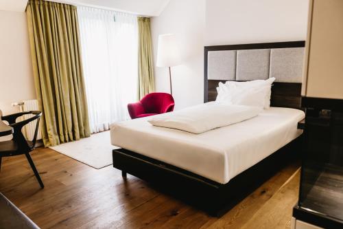 Un ou plusieurs lits dans un hébergement de l'établissement Steigenberger Hotel & Spa Krems