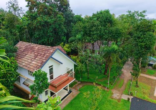 an aerial view of a house with a garden at Kedara Resort Wayanad by VOYE HOMES in Sultan Bathery