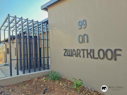 a building with a sign on the side of it at 99 on Zwartkloof - Luxury Bushveld Retreat in Warmbaths