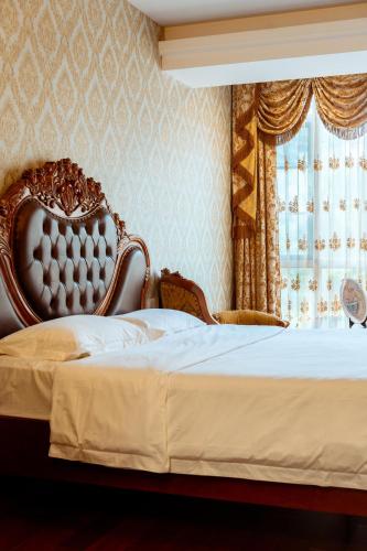 Katil atau katil-katil dalam bilik di Golden Peach Riverside Manor