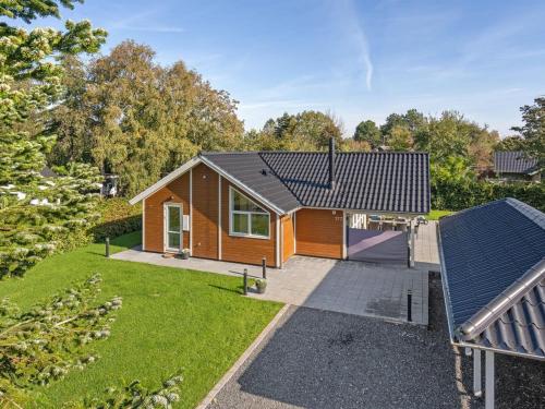 an aerial view of a house with a yard at Holiday Home Hellena - 90m from the sea by Interhome in Skovmose