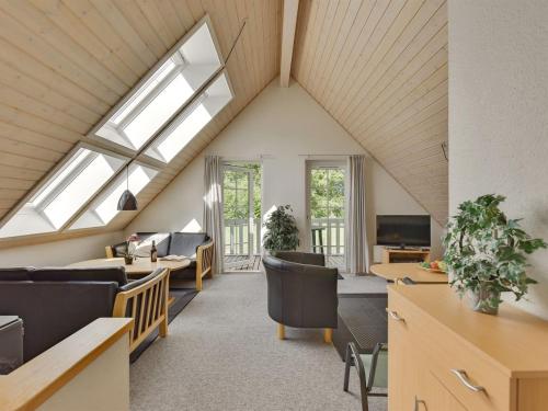 an attic office with skylights and a living room at Holiday Home Fausta - 150m to the fjord by Interhome in Gråsten