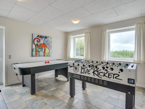 a ping pong table in a room with graffiti on it at Holiday Home Ammy - 7-5km from the sea by Interhome in Højer