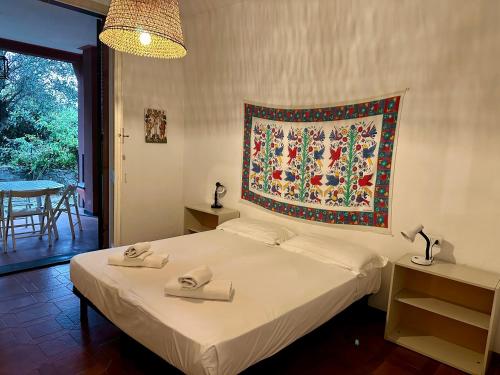 Ένα ή περισσότερα κρεβάτια σε δωμάτιο στο Casa Berizzi Mare - Arenzano Pineta Centro