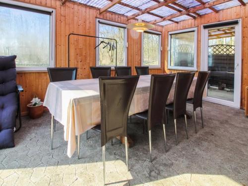 a dining room with a table and chairs at Holiday Home Edy - 25km from the sea by Interhome in Toftlund