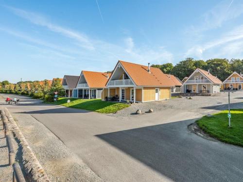 a row of houses in a residential neighborhood at Holiday Home Joris - 100m to the inlet by Interhome in Gråsten