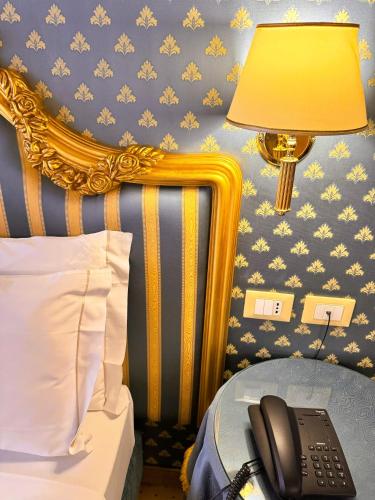Postel nebo postele na pokoji v ubytování Hotel Corte Contarina