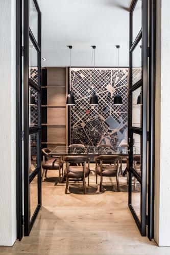 a dining room with a table and chairs at Midtown Apartments in Barcelona