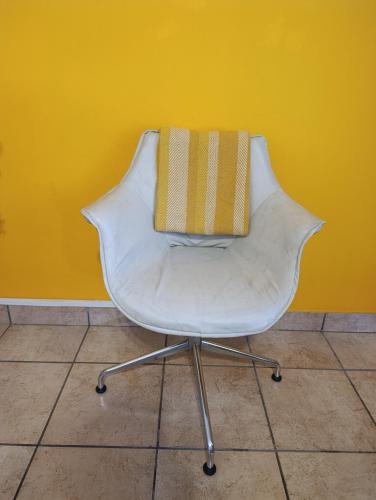a white chair with a bag on top of it at Platinum gem in the City of Rustenburg in Rustenburg