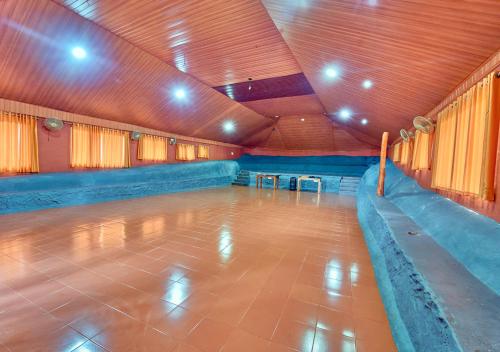 a empty room with a dance floor in a gym at Kedara Resort Wayanad by VOYE HOMES in Sultan Bathery