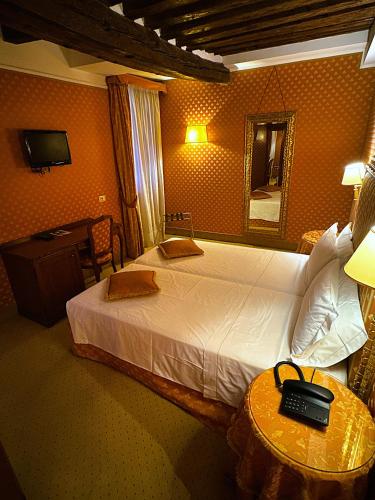 Postel nebo postele na pokoji v ubytování Hotel Corte Contarina