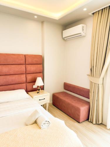 a bedroom with a bed and a pull out couch at Blumoon Holiday in Golem