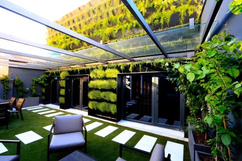 a patio with plants on the side of a building at Charm Flats in Lisbon