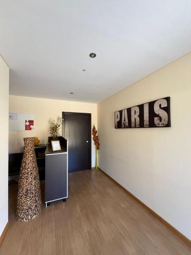 an empty room with a sign that reads paris on the wall at Paris By Palacium Group in Figueiró dos Vinhos
