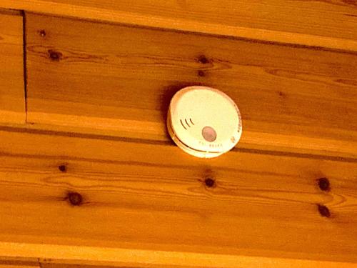 a wooden ceiling with a clock on it at Top Hill woman only accommodation in Wada
