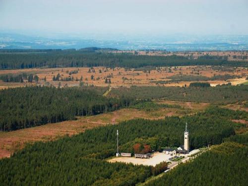 an aerial view of a church in the middle of a field at Large Home with Sauna, Ovifat in Ovifat