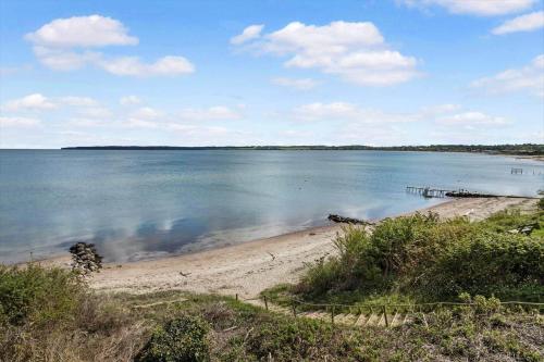 a large body of water with a sandy beach at 40607-Juelsminde-Pilevaenget-16 in Snaptun