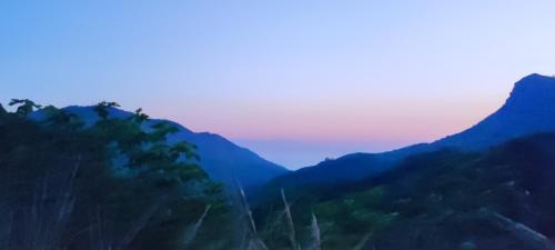 a view of a mountain range at sunset at Lumira Vista - Borgo in Sangineto